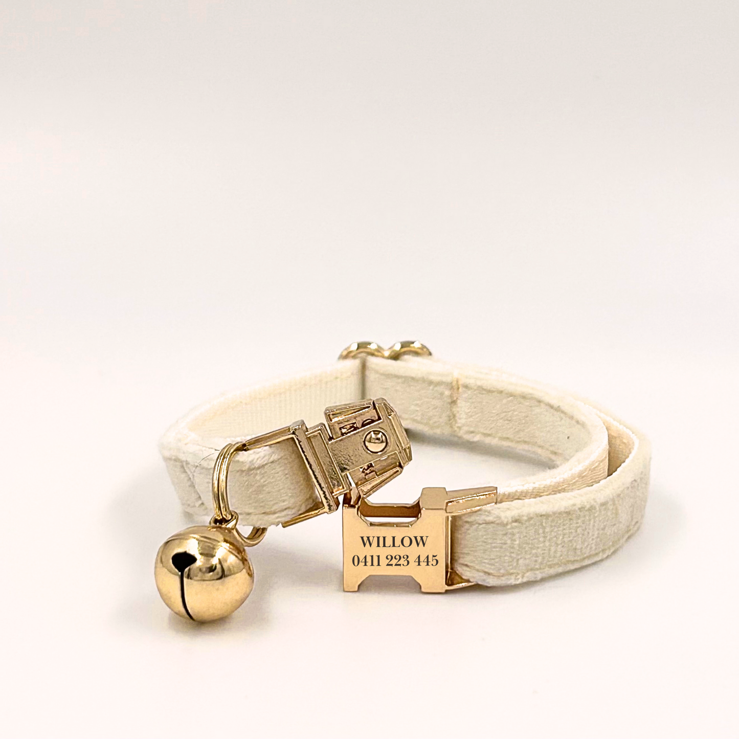 Personalised velvet cat collar - white colour with a gold buckle and bell. Add personalised engraving on the buckle.